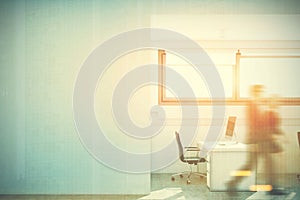 Open space office, a blank white wall, people