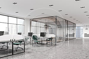 Open space office with green chairs, meeting room