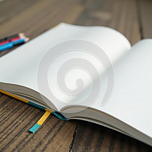 Open spiral bound notebook; crisp white pages await , texture, dot grid photo