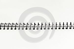 Open spiral notebook with blank empty cloud white dancer sheets, closeup top view, paper background. Demonstrating color, trend
