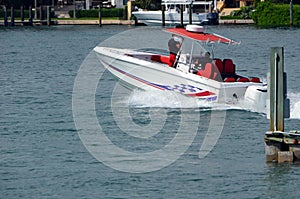 Open sports fishing boat powered by two outboard engines