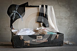 Open suitcase with old things