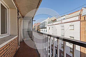 Open terrace with painted iron railing