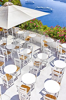 Open Terrace in Thira with Line of Cruise Ships on Background