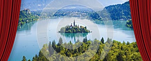 Open theater red curtains against Bled lake, the most famous lake in Slovenia with the island of the church Europe - Slovenia -