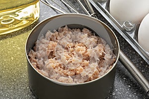 Open tin with canned crabmeat close up