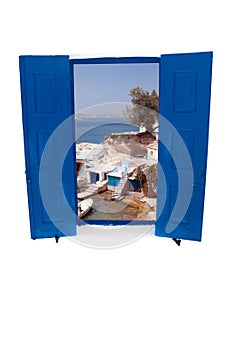 Open traditional Greek blue window on Mykonos island