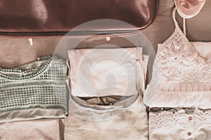 Open traveler`s bag with clothing, accessories and passport, travel and vacations concept .Travel suitcase preparation concept