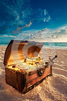 Open treasure chest on the beach