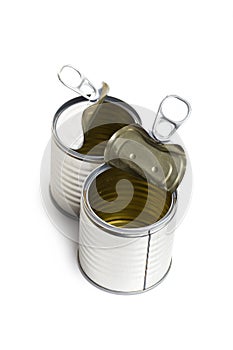 Open two empty tin cans on a white background