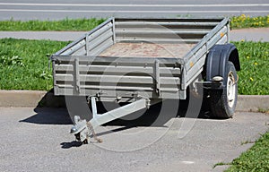 Open two-wheeled trailer for passenger car