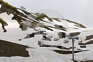 Open-type cable car over snow-covered mountains