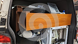 An open van packed full of household clearance goods photo