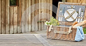 Open vintage fitted picnic hamper with baguettes