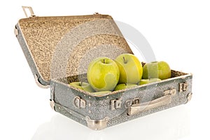 Open vintage suitcase with fruit