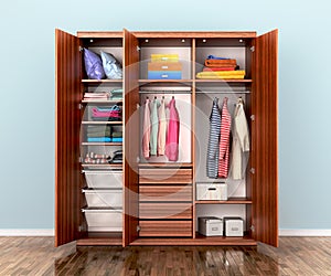 Open wardrobe compartment with clothes