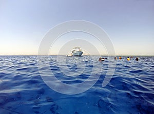 Open water and divers with boat