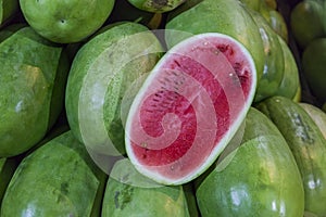 Open watermelon on some piled