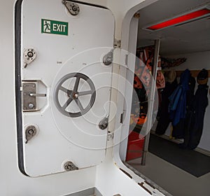 Open white door of a ship