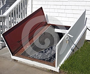 Open white storm cellar door