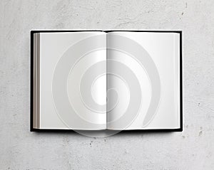 Open white textbook on concrete. 3d render