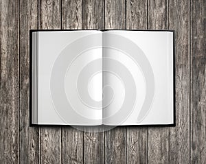 Open white textbook on natural wood. 3d render photo