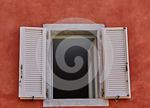 Open white window on the Red Wall