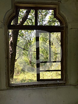 an open window in an abandoned house