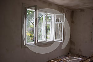 Open window repair in the room,ventilate the room after repair with an open window photo