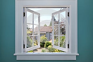 Open window to the back yard with small shed.