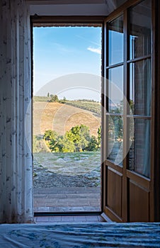 open window view at the hills of Toscany Italy