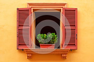 Open window on the yellow wall