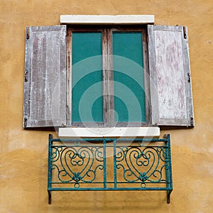 Open Window On yellow Wall