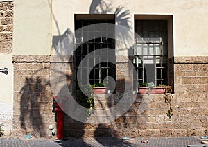 Open windows with bars in the old city of Jaffa in Tel Aviv, Israel.