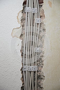 open wires in the interior and preparations for switches and sockets on a construction site