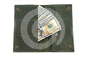 Open women`s wallet with dollars inside