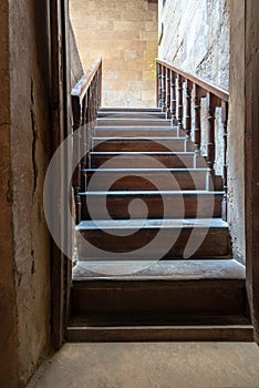 Open wooden door revealing wooden old staircase going up, Cairo, Egypt