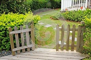 Open wooden gate and fence