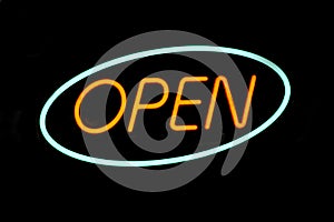Open written with LED lights with black background