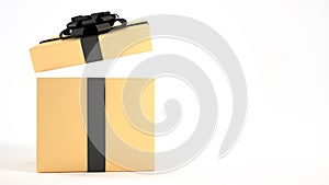Open yellow gold gift box with black ribbon and bow isolated on white background.