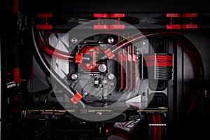 Open your computer with a water cooling system, a processor, a graphics card, a motherboard fan