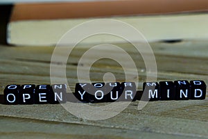 Open your mind on wooden blocks. Motivation and inspiration concept