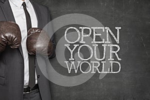 Open your world on blackboard with businessman on