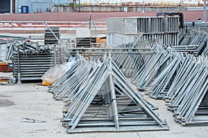 Openair storage of galvanized steel and aluminum frames, ladders, and ringlock scaffolding systems for many applications on
