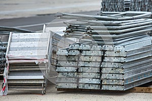 Openair storage of galvanized steel and aluminum frames, ladders, and ringlock scaffolding systems for many applications on