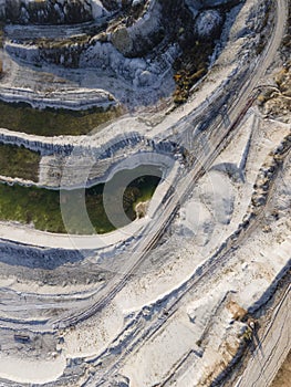 Opencast mining quarry - Aerial view. Industrial Extraction of lime, chalk, calx, caol