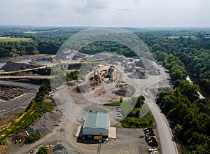 Opencast mining quarry for the extraction of in the middle of the forest