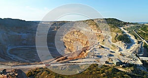 Opencast mining quarry with lots omachinery at work.