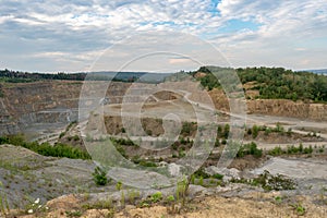 Opencast mining quarry with machinery.