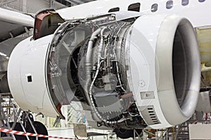 Opened aircraft engine in the hangar